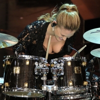 Bar Refaeli performs on the drums… and her bra’s the support act
