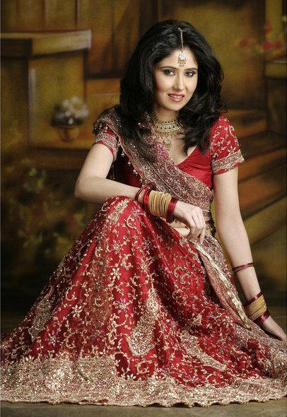 silk lehenga in red on maroon shades with heavy work