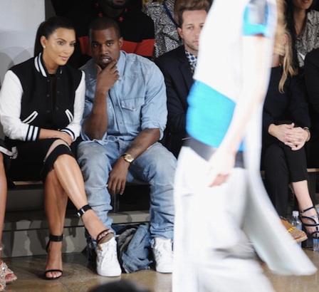 TV Personality Kim Kardashian and Rapper Kanye West attend Louise Goldin Spring 2013