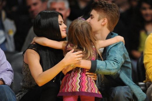 Selena Gomez and Justin Bieber at a basketball game between the San Antonio Spurs and the Los Angeles Lakers