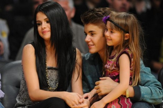 Selena Gomez and Justin Bieber at a basketball game between the San Antonio Spurs and the Los Angeles Lakers
