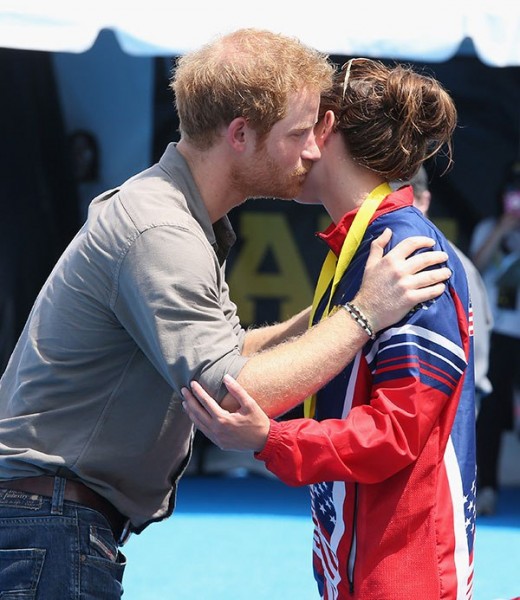 Prince Harry Kisses & Hugs Pretty Gold Medal Winning Military Hero